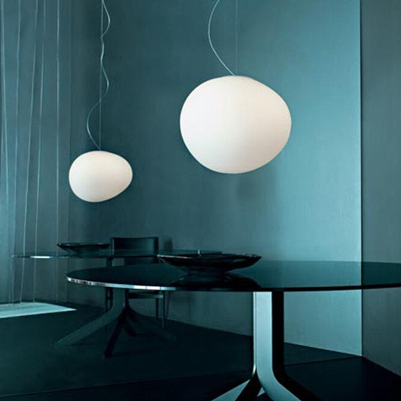 Pebble pendant lamp over dining table
