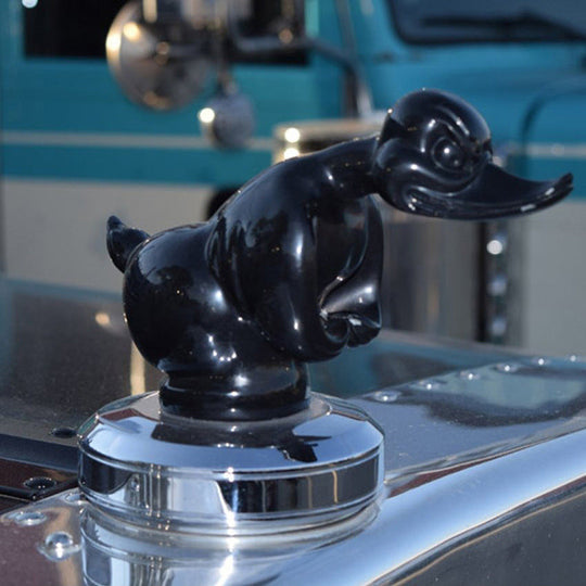 Chrome angry duck hood ornament close up
