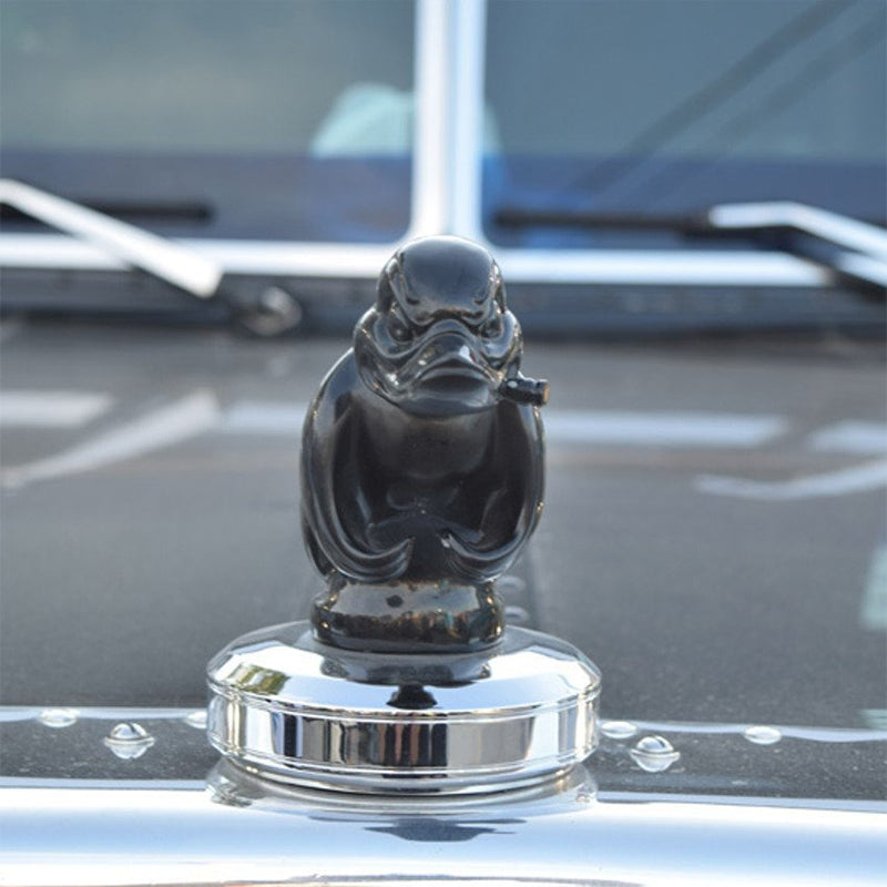 Black angry duck hood ornament close up