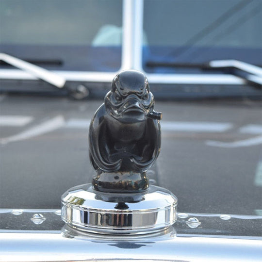 Black angry duck hood ornament close up