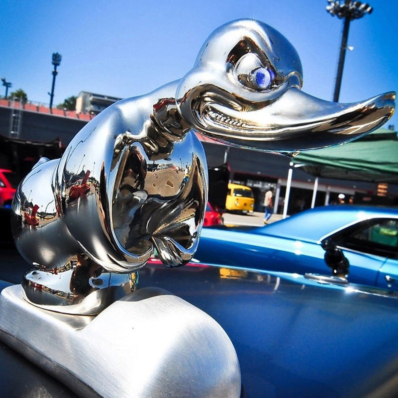 Black angry duck hood ornament on truck