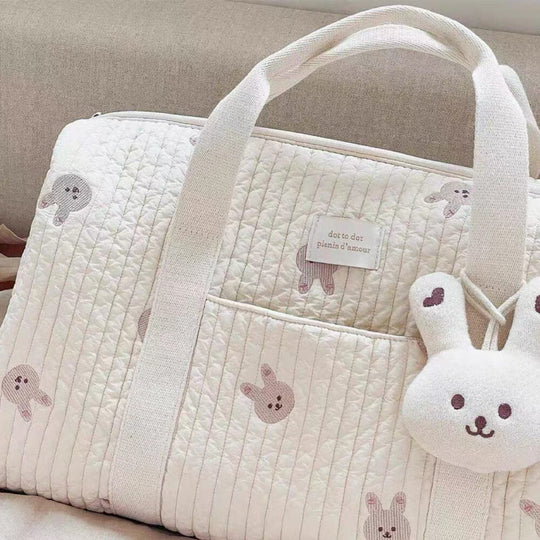 Bear print bag held