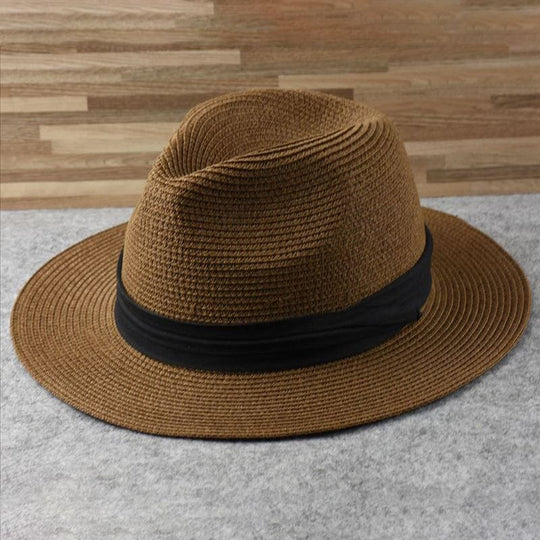 Brown straw panama hat with black band