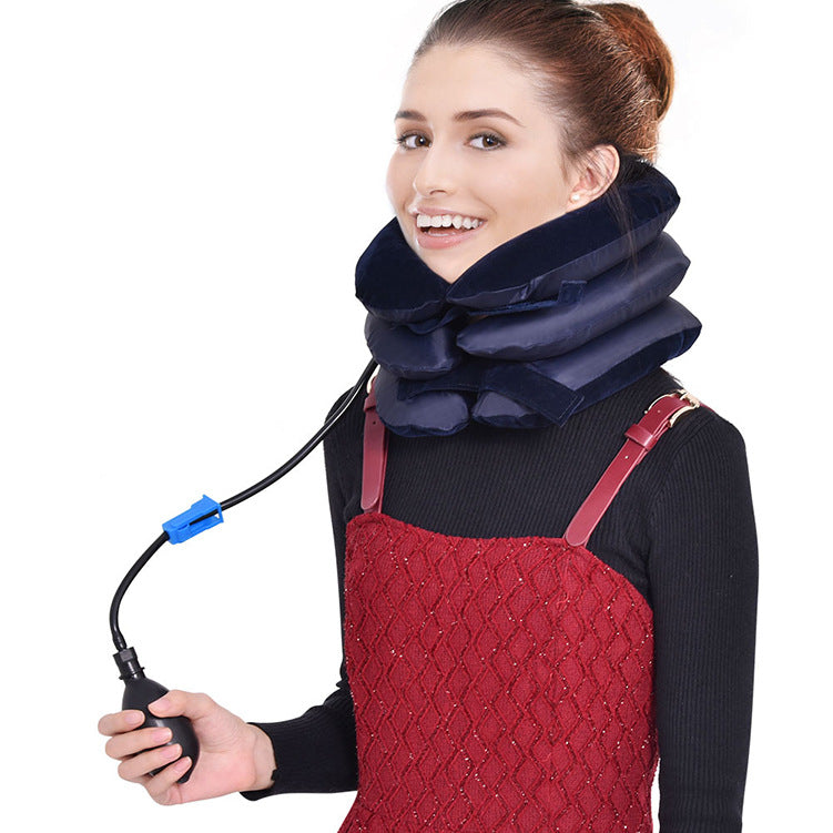 Blue neck traction device with hand pump in use