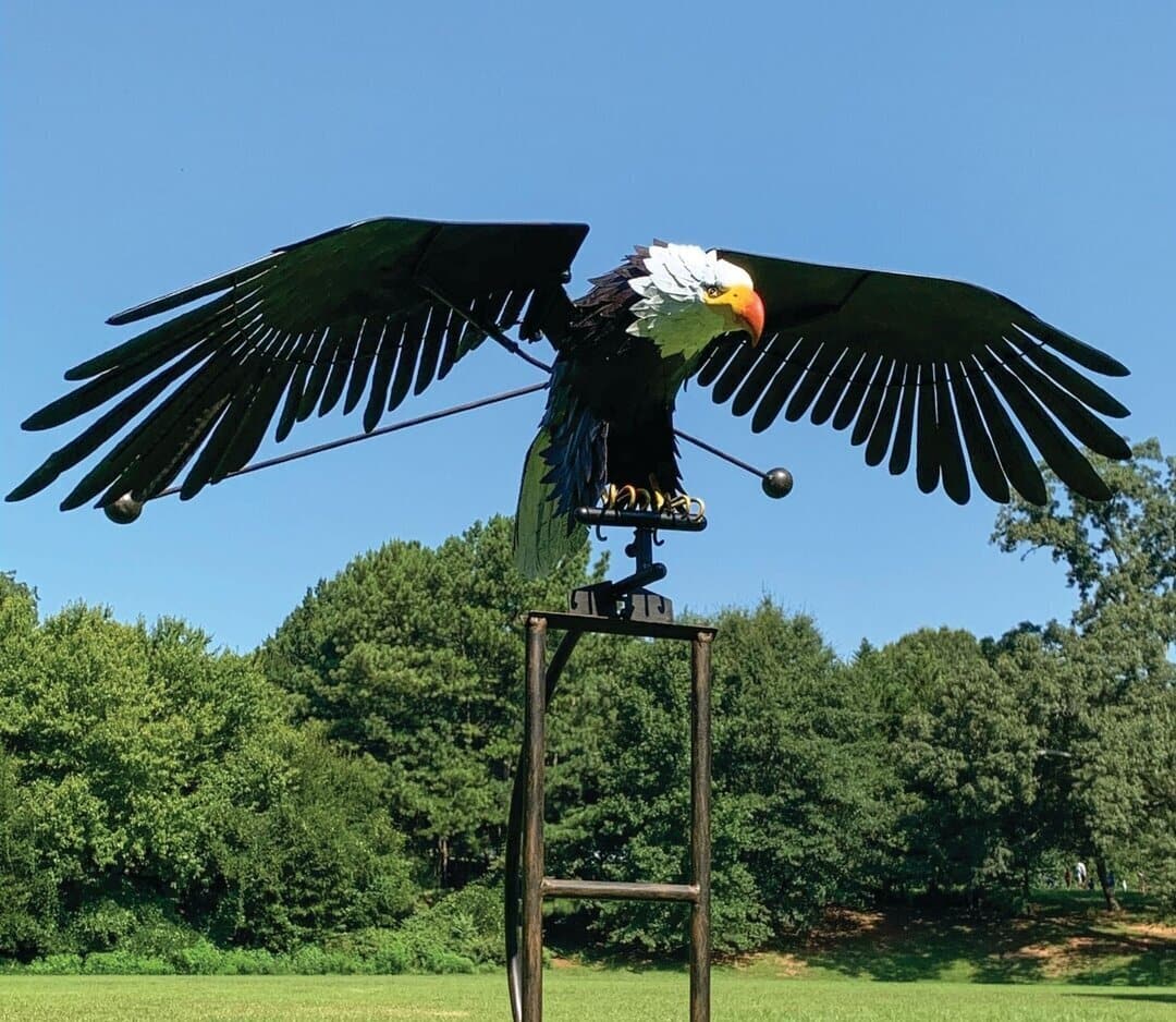 Flying eagle metal wind spinner in garden