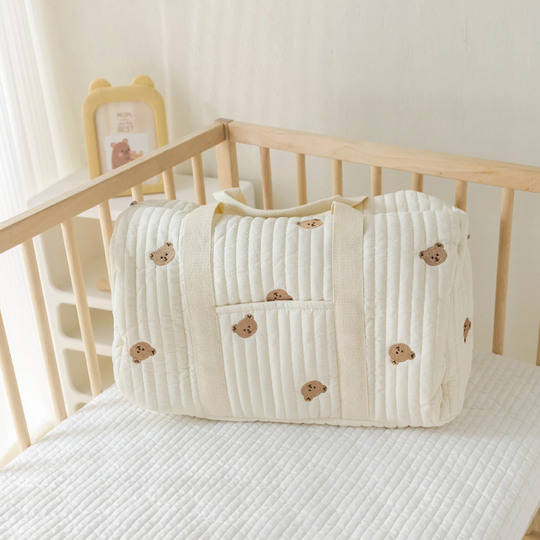 Bear print bag in crib