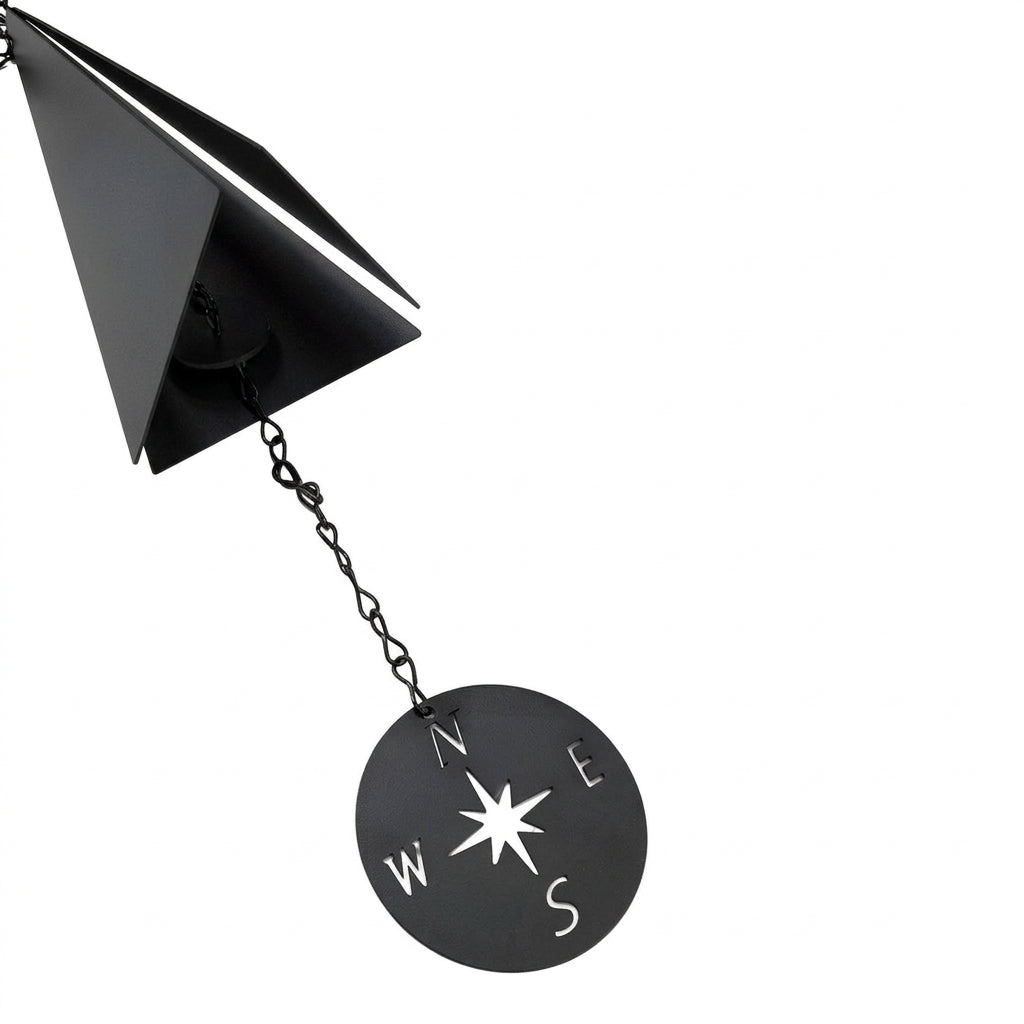 Close-up of wind bell and compass windcatcher