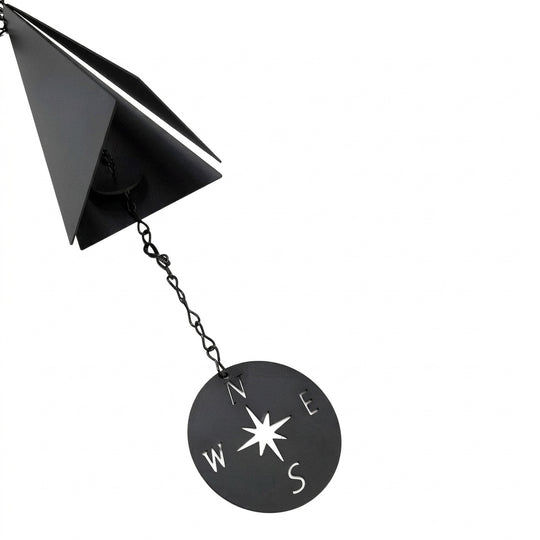 Close-up of wind bell and compass windcatcher