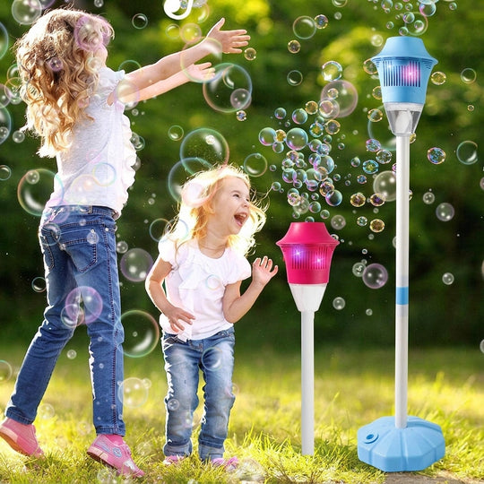 Children playing outdoors with the bubble maker machine