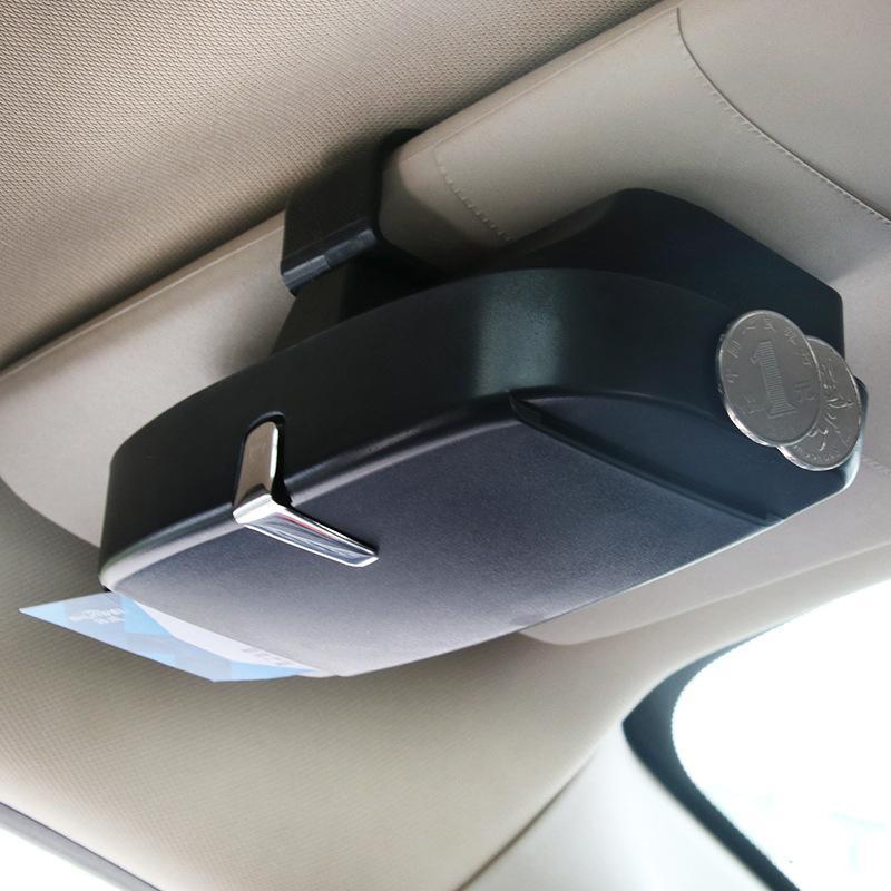 Gray visor sunglasses holder on car visor