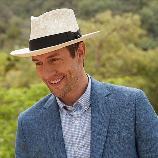 Man wearing a classic straw panama hat outdoors