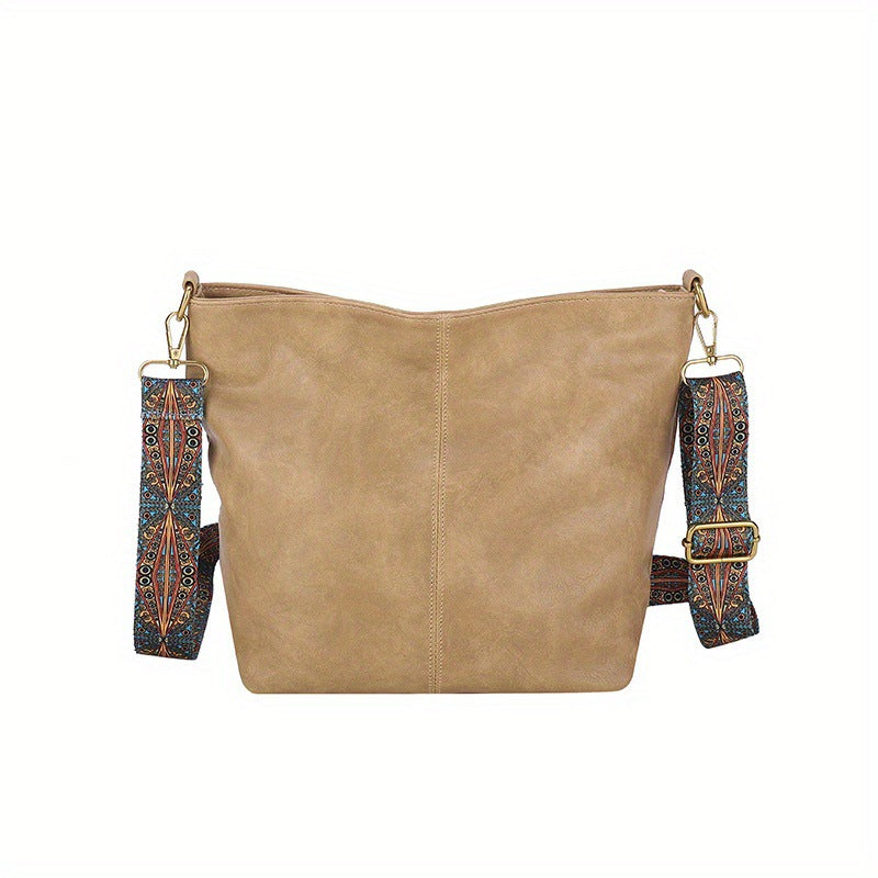 Beige leather shoulder bag with patterned strap
