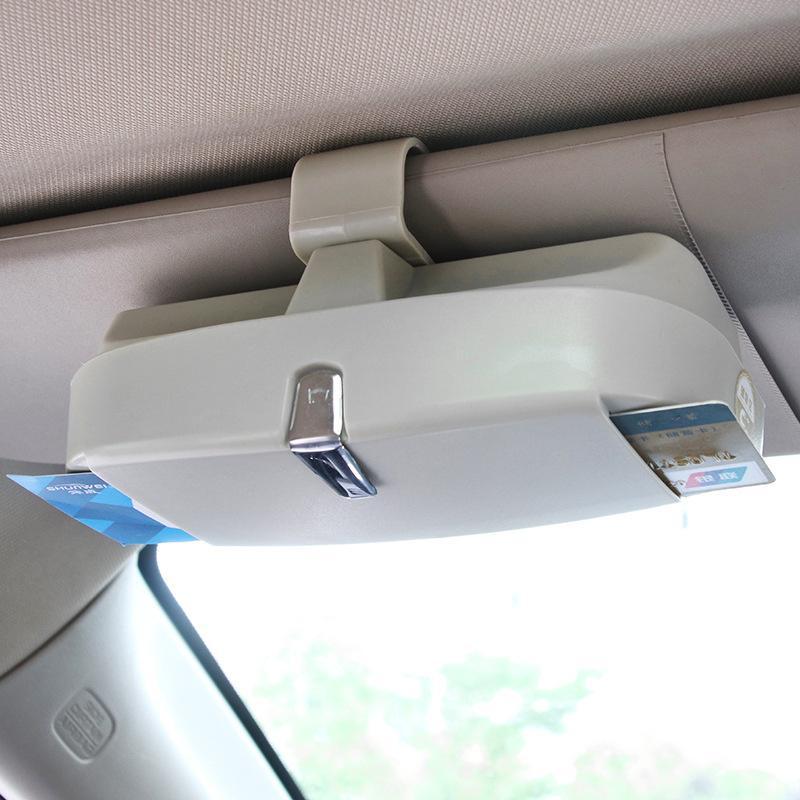 Beige visor sunglasses holder on car visor
