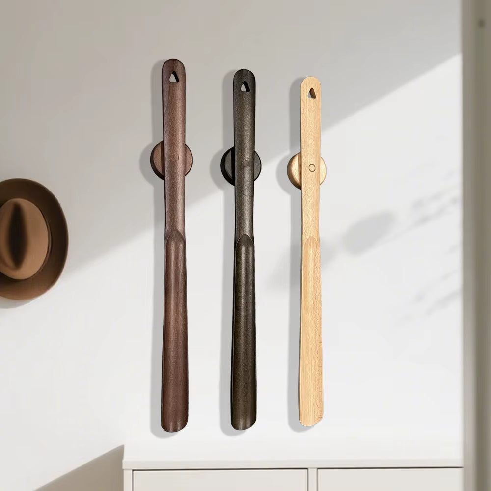 Wooden shoehorns on wall