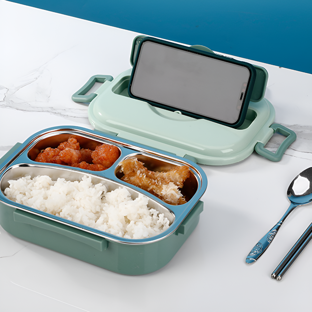 Green lunch box with phone on lid