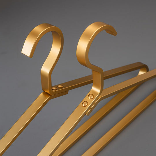 Stack of gold alloy hangers