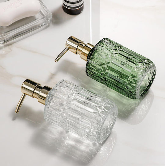 Glass soap dispenser with gold pump