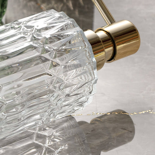 Clear glass soap dispenser detail