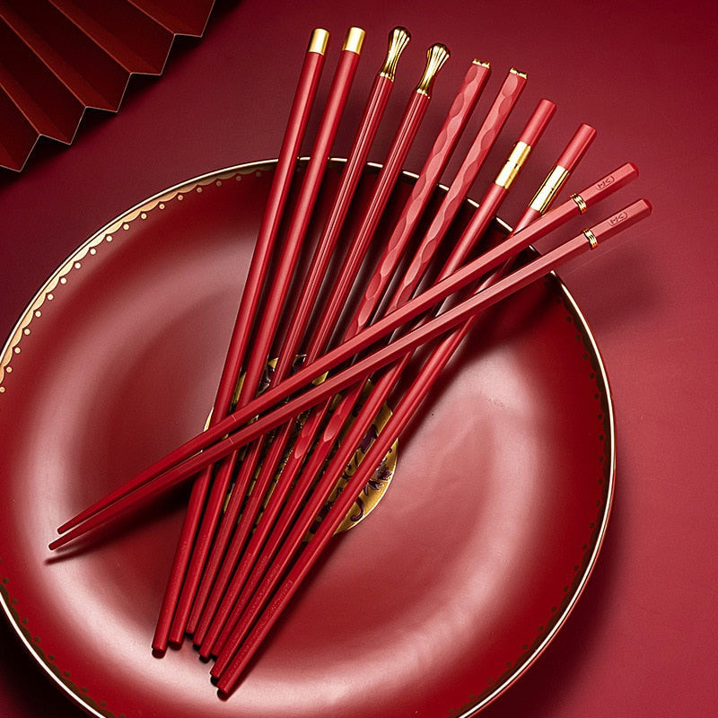 Red chopsticks set on red plate