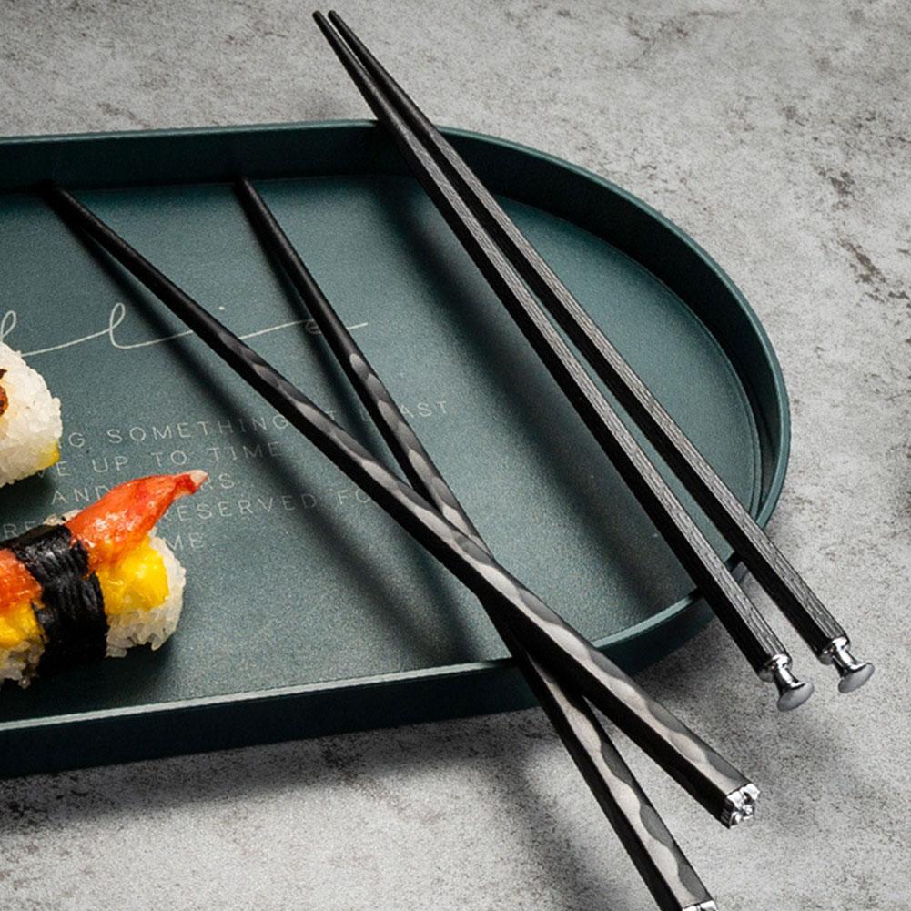Black chopsticks with sushi tray