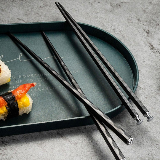 Black chopsticks with sushi tray
