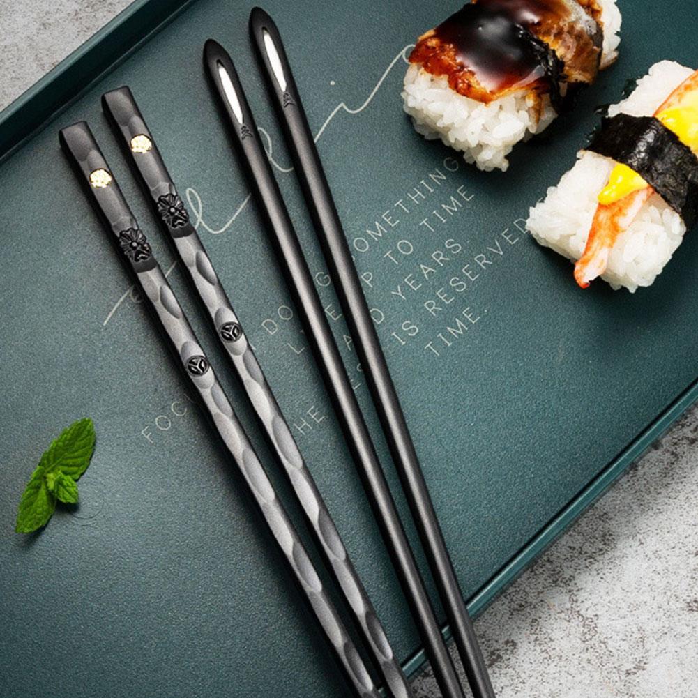 Black chopsticks on tray