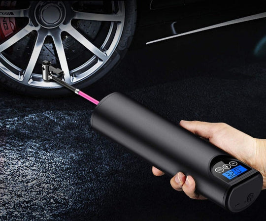 Air pump inflating a car tire