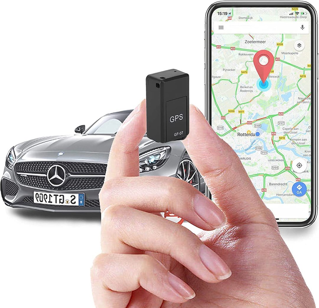 Mini GPS tracker held in hand with phone map