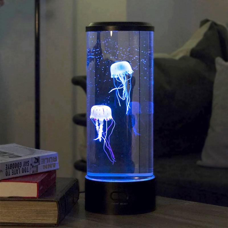 Blue jellyfish lamp beside books