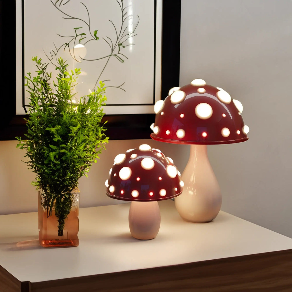 Red mushroom table lamp set glowing on a console