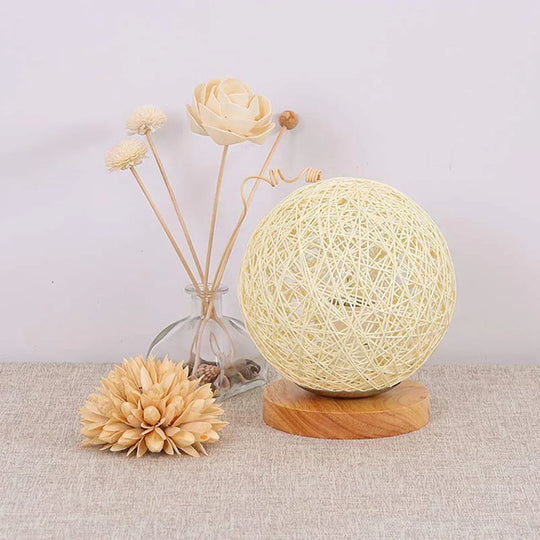 Rattan sphere lamp lit at night