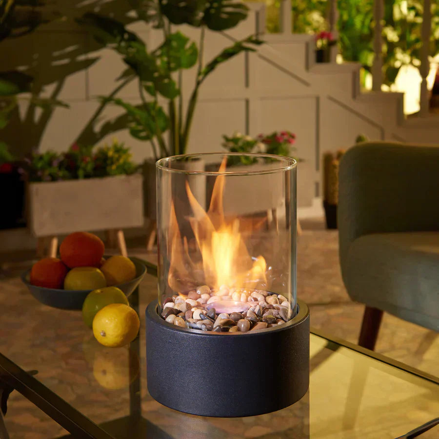 Tabletop fireplace with flame on table