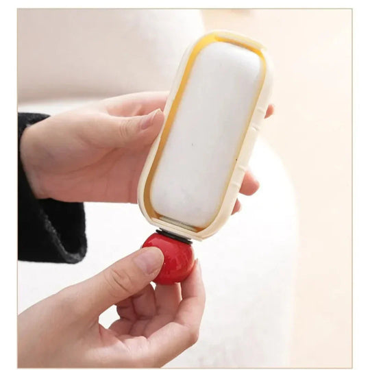 Hand holding reusable lint roller