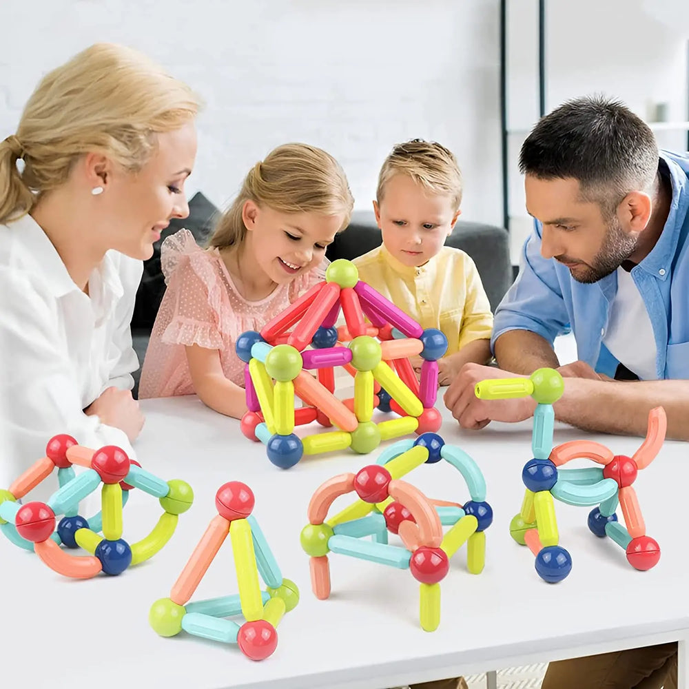 Family playing with magnetic building set