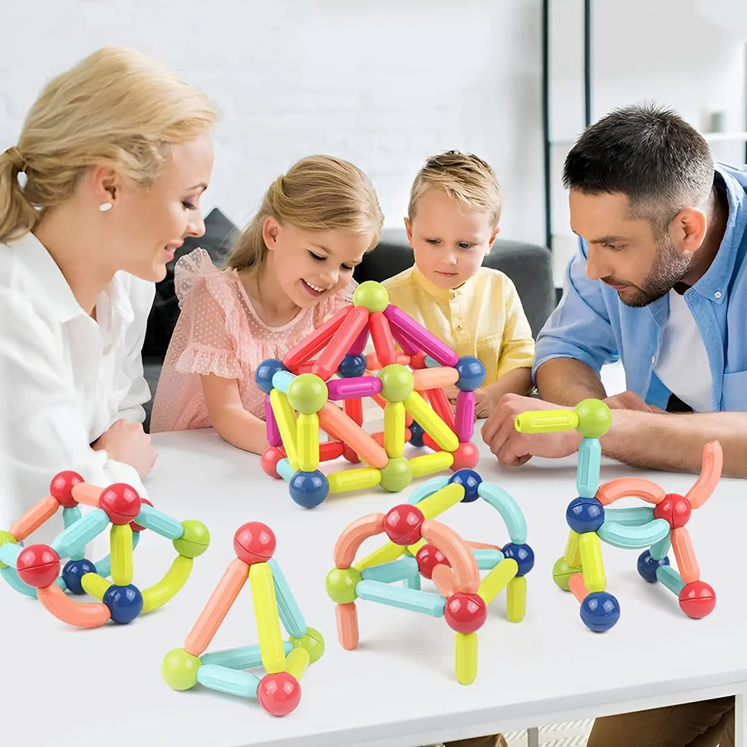 Family playing with magnetic building set