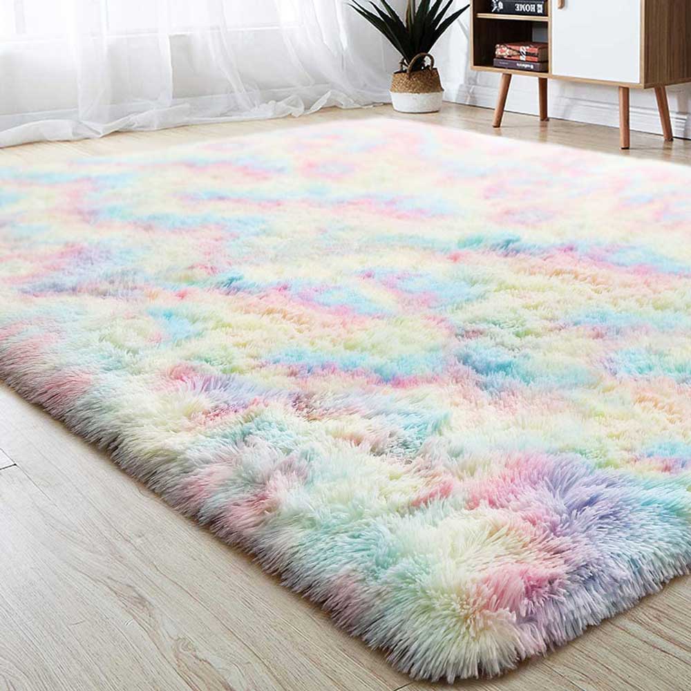Pastel rainbow shag rug on wood floor