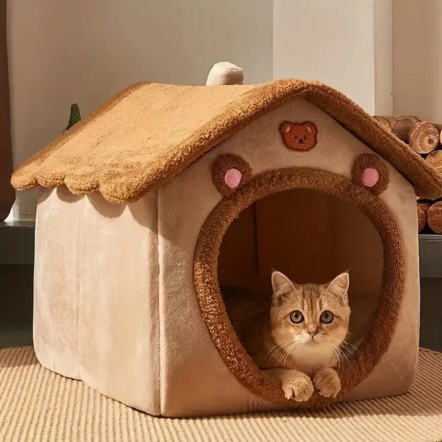 Cozy pet house bed with a cat resting in the doorway