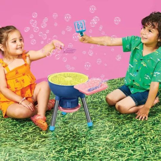 Children playing with the grill bubble maker outdoors