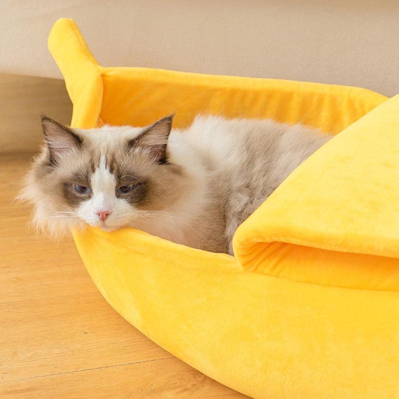 Yellow banana cat bed with fluffy cat