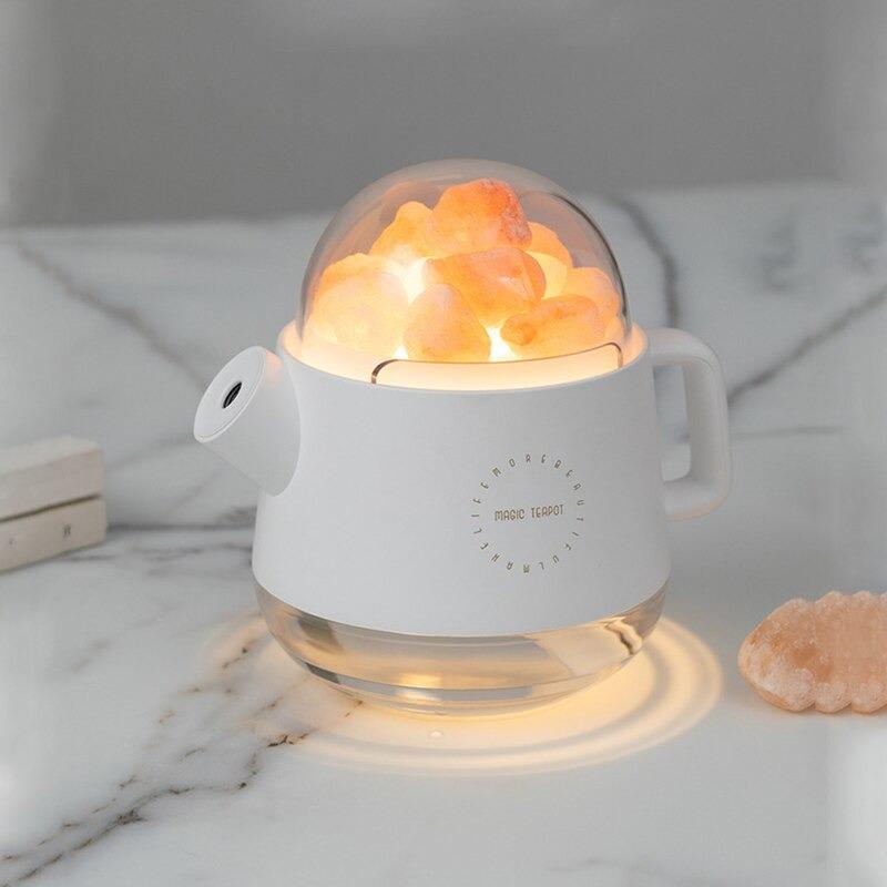 White teapot salt lamp humidifier on table