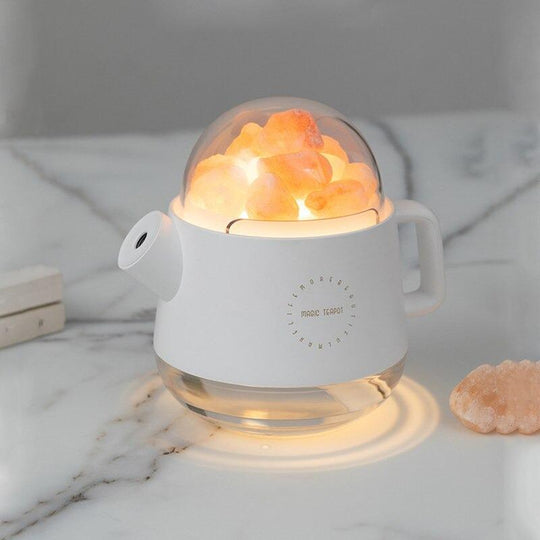 White teapot salt lamp humidifier on table