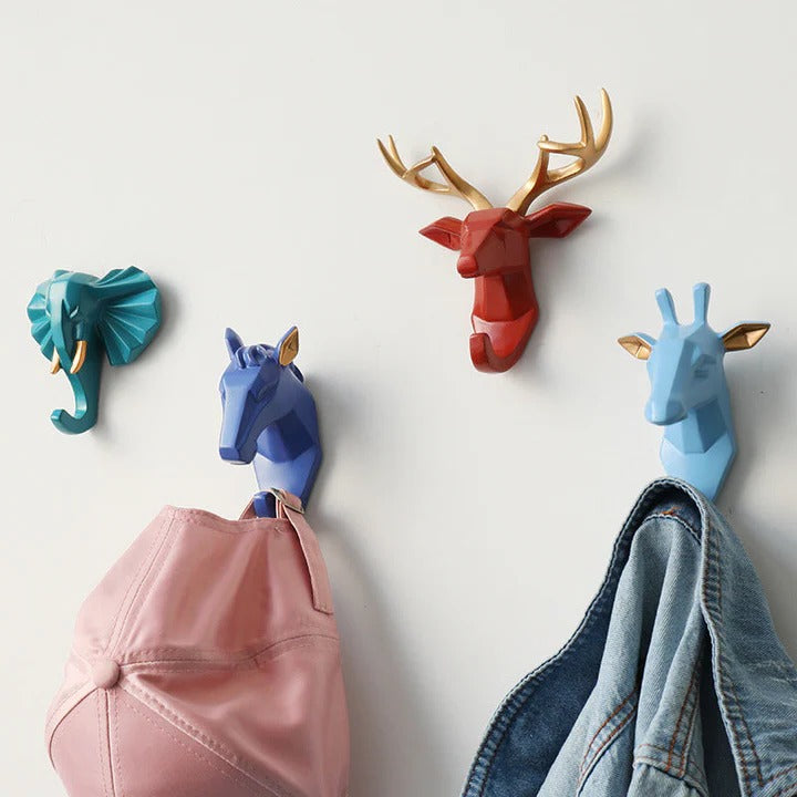Geometric animal head wall hooks styled in a room