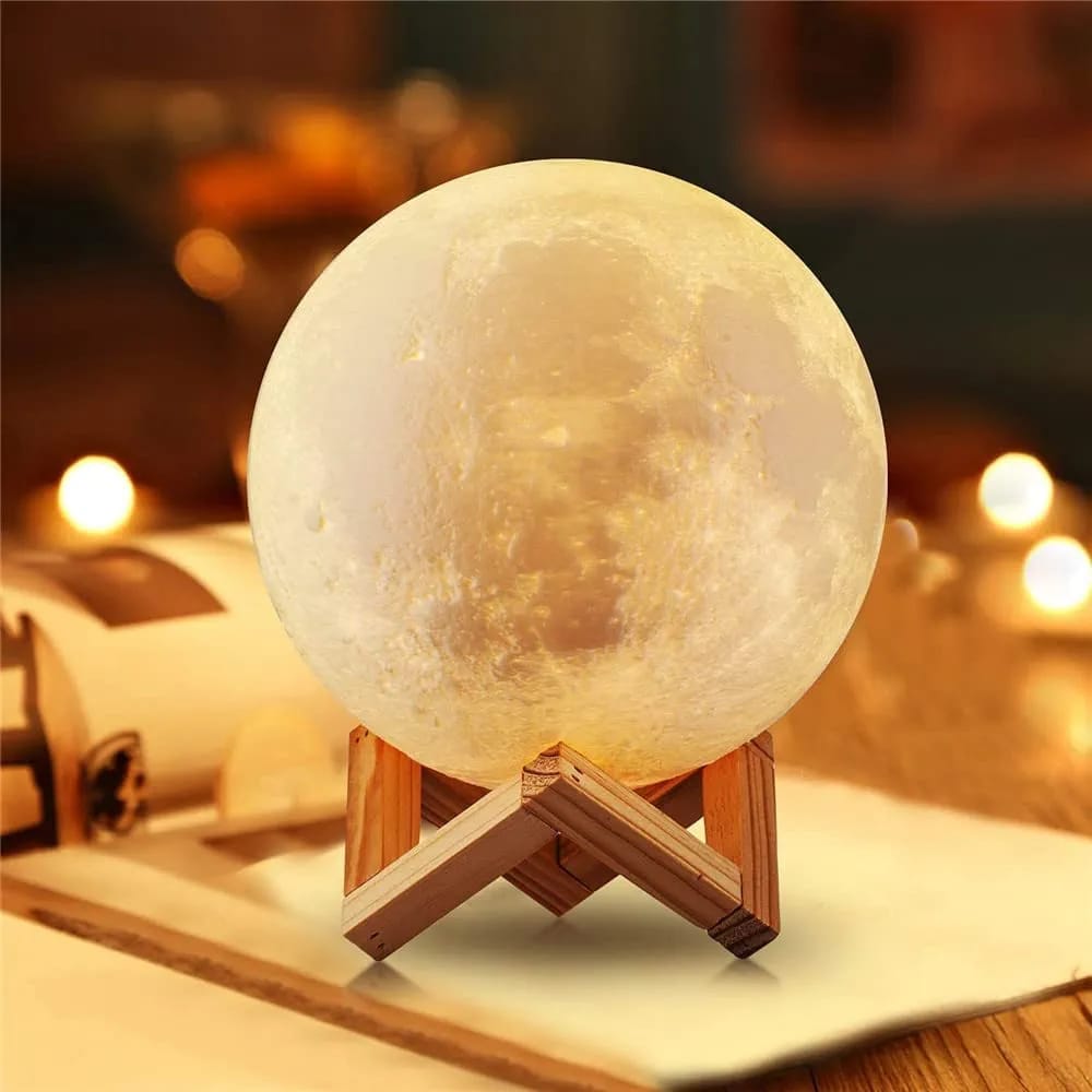 3D moon night lamp glowing warm on a wooden stand