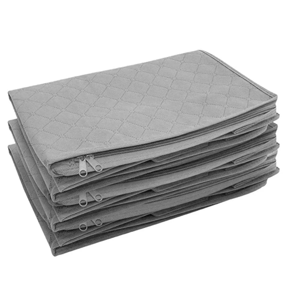Folded grey storage bags stacked