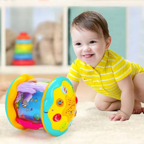 Baby playing with sensory drum toy