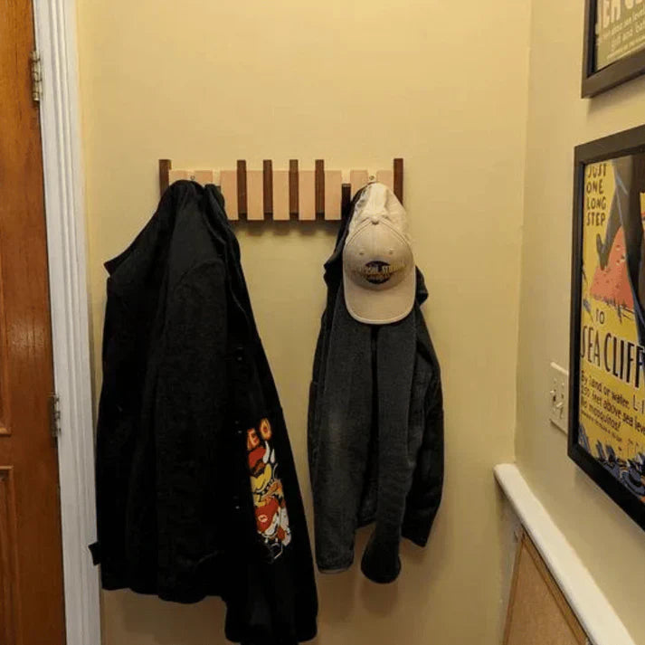 Wooden wall coat rack with folding hooks