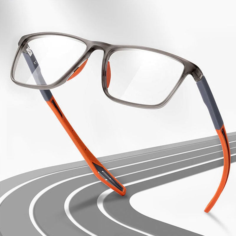 Orange reading glasses on running track