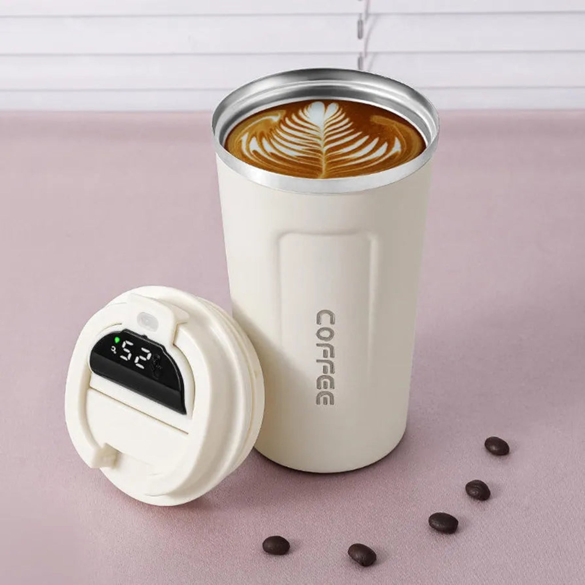 White stainless steel mug with temperature display