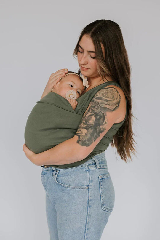 Parent wearing baby carrier shirt