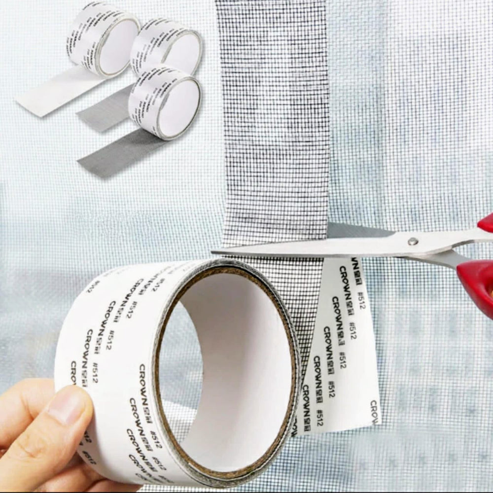 Cutting mesh repair tape over a window screen